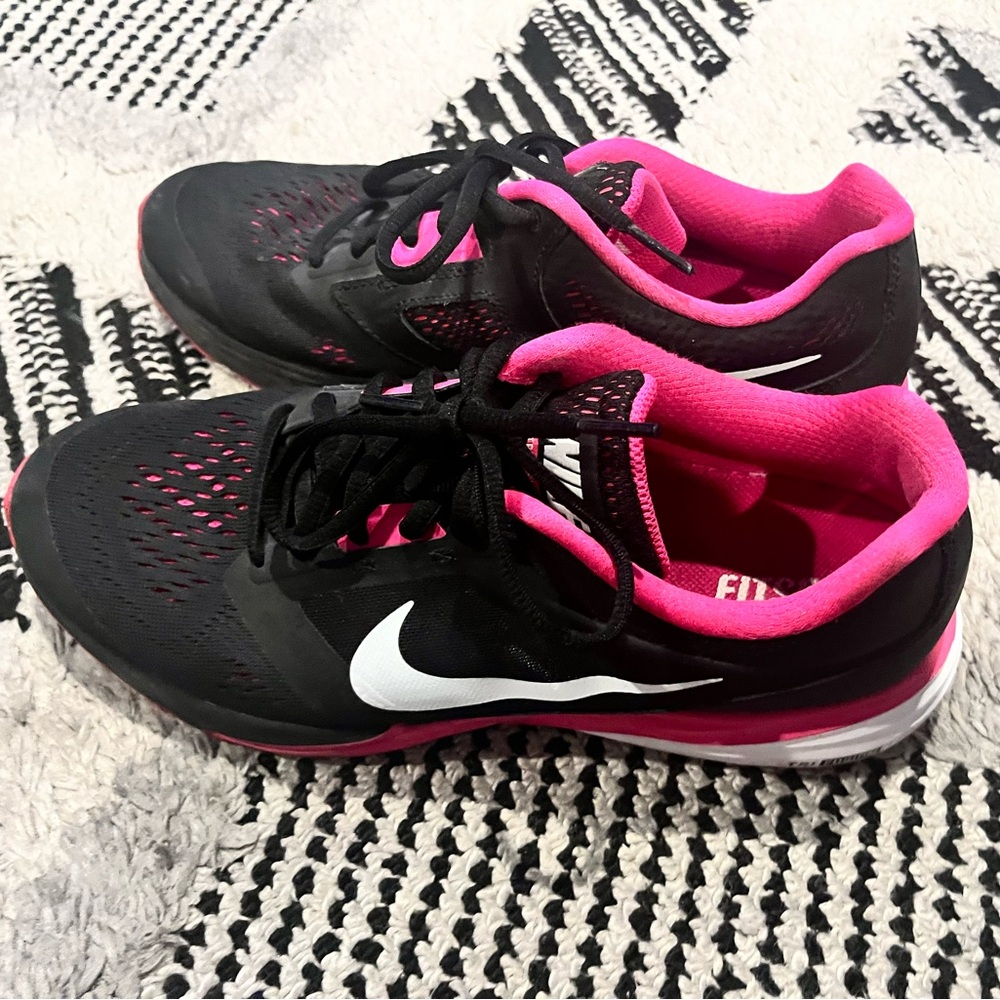 Pink and black Nike sneakers